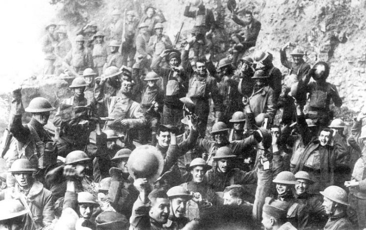 Men of U.S. 64th Regiment, 7th Infantry Division, celebrate the news of the Armistice, November 11, 1918
