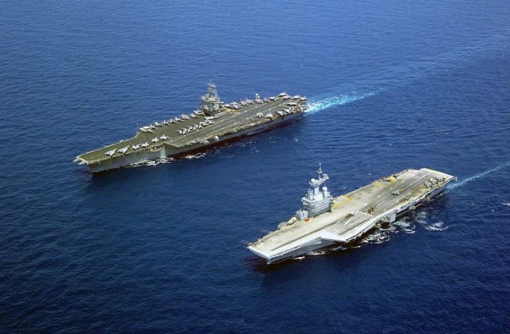 USS Enterprise (left), the first nuclear-powered aircraft carrier, and Charles de Gaulle (right), at that time the newest nuclear carrier, both steaming in the Mediterranean Sea on 16 May 2001.