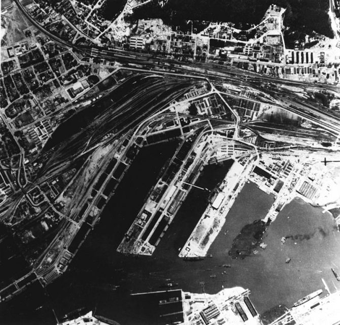 An aerial reconnaissance photo of Gotenhafen, Germany (today Gdynia, Poland), taken by a British Royal Air Force aircraft in June 1942. Visible are the damaged battlship Gneisenau, which was under repair and reconstruction at this time. The incomplete aircraft carrier Graf Zeppelin appears in the lower center of this photograph.