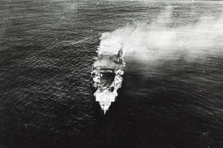 The burning Japanese aircraft carrier Hiryū, photographed by a Yokosuka B4Y aircraft from the carrier Hosho shortly after sunrise on 5 June 1942. Hiryu sank a few hours later.