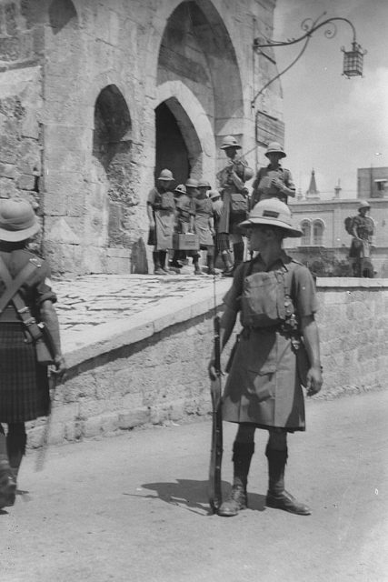 Armed British soldiers on duty patrolling outside the citadel (david’s tower) in the old city of Jerusalem during the Arab riots against Jews