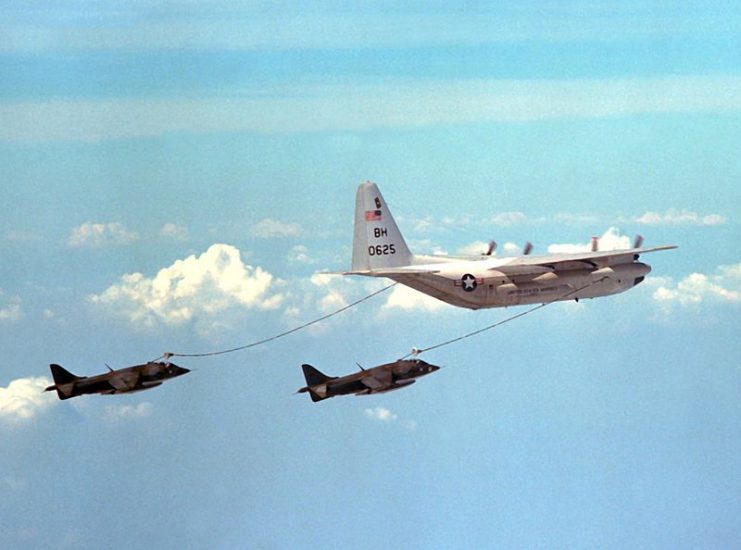 A pair of USMC AV-8A Harriers refueling from a Lockheed Martin KC-130 tanker.