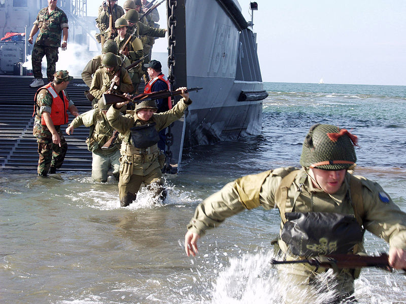 Actors portraying soldiers from World War II, depart a landing craft during the 6th annual D-Day reenactment ceremonies in Conneaut, Ohio. Three Hundred reenactors relive the allied assault on Omaha Beach, Normandy, France.