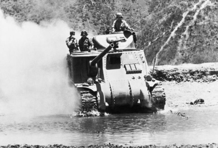 A British Lee tank crosses a river north of Imphal to meet the Japanese advance in Burma, 1944