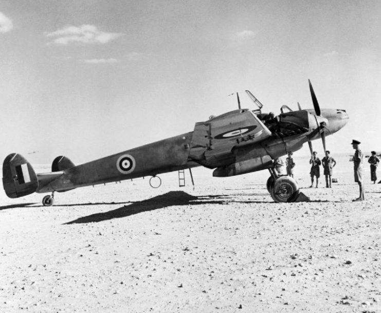 A captured German Messerschmitt Me 110D “The Belle of Berlin” in British markings on a landing ground in North Africa.