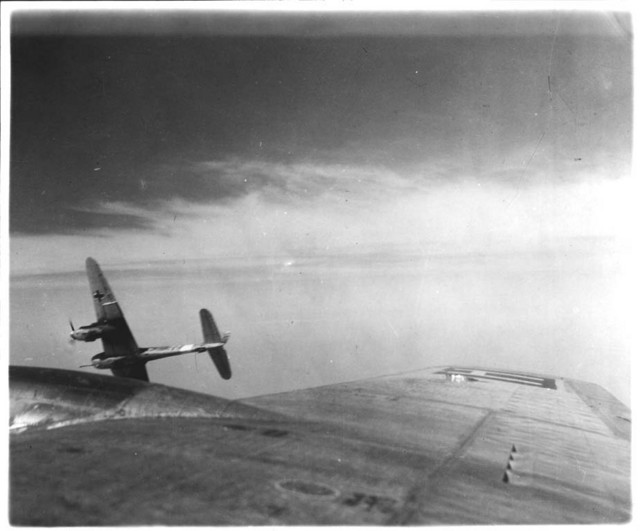 A Messerschmitt Me 410 with a BK 5 heavy autocannon peels off from attacking a 388th Bomb Group B-17 over Europe during the USAAF campaign against Germany, 1943