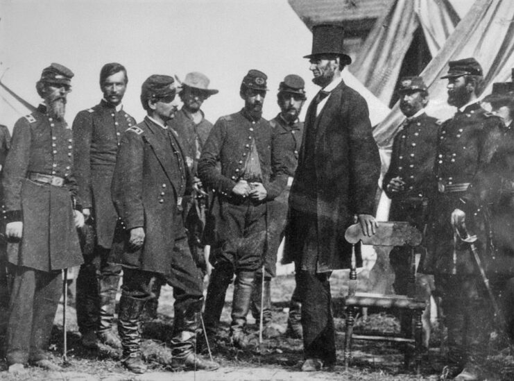 Soldiers standing around Abraham Lincoln