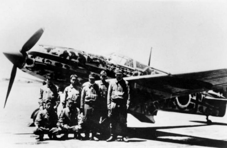 Aircrew with a Kawasaki Ki-61 Hien at an unidentified airfield. This aircaft was probably assigned to the of the 244th Squadron. Note the (at least) 12 “kill” markings below the cockpit.