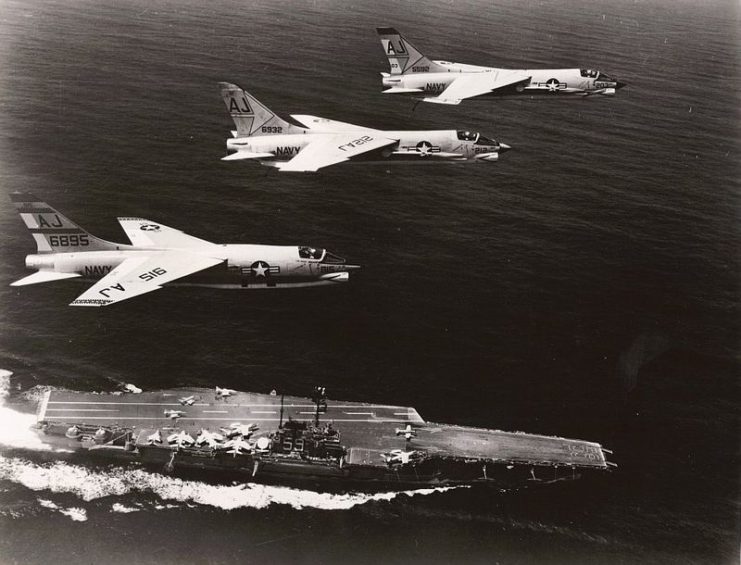 An RF-8A and a pair of F-8C Crusaders overfly Forrestal during her 1962–63 Mediterranean cruise