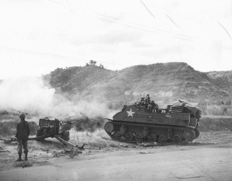 Artillery guns blast a Japanese position on Luzon