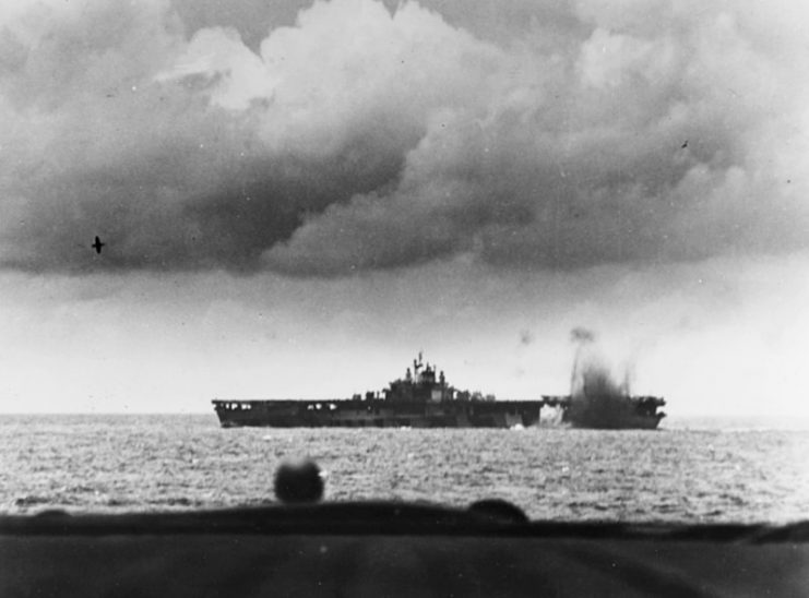Battle of the Philippine Sea, June 1944- the U.S. Navy aircraft carrier USS Bunker Hill (CV-17) is near-missed by a Japanese bomb, during the air attacks