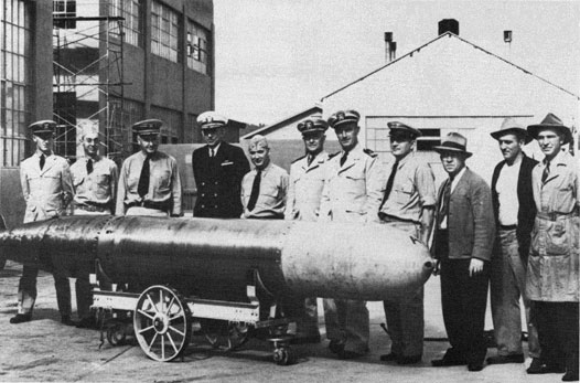 Captain Theodore Westfall, NTS CO and Captain Carl Bushnell of the Bureau of Ordnance, inspect a Mark 14 torpedo at the Naval Torpedo Station, Keyport, Washington, 1943