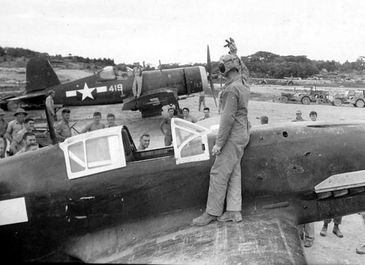 Captured Kawasakie Ki-61 with F4U Corsair in background – Okinawa 1945