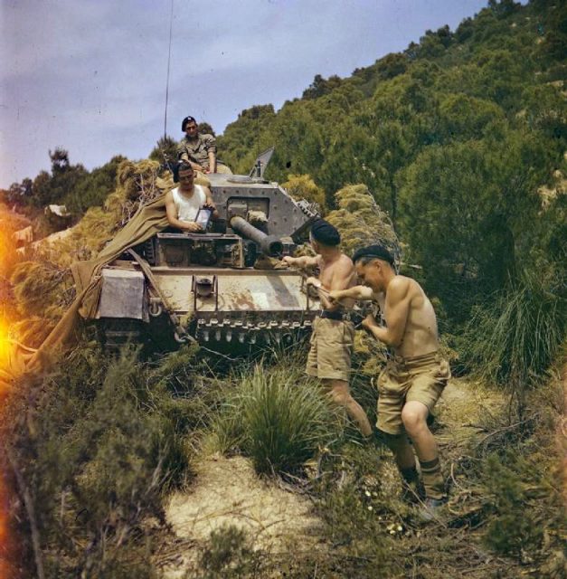 Cleaning the barrel of the 6-pdr in Tunisia.1943