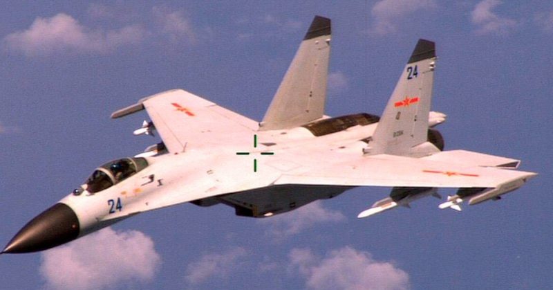 Chinese Shenyang J-11B fighter intercepting an American P-8. The photo was taken by the crew of the P-8.