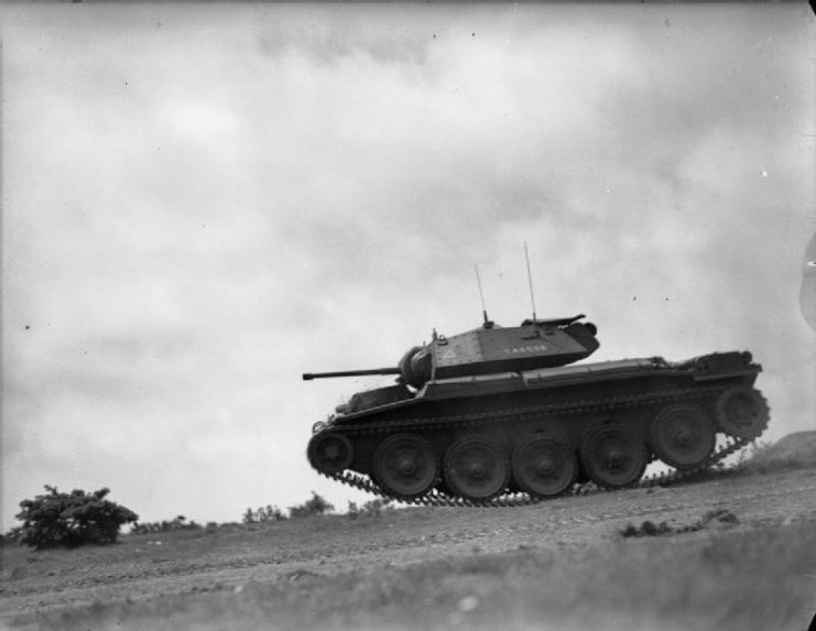 Crusader tank of ‘A’ Squadron, 24th Lancers, 11th Armoured Division at speed during an exercise in Sussex, 15-16 July 1942.