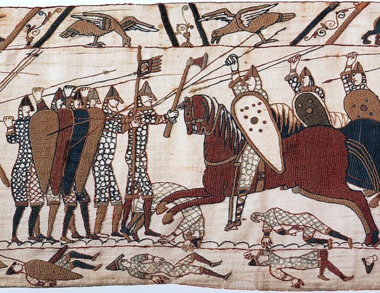 Depiction from the Bayeux Tapestry of Norman cavalry attacking Anglo-Saxons who are fighting on foot in a shield wall.