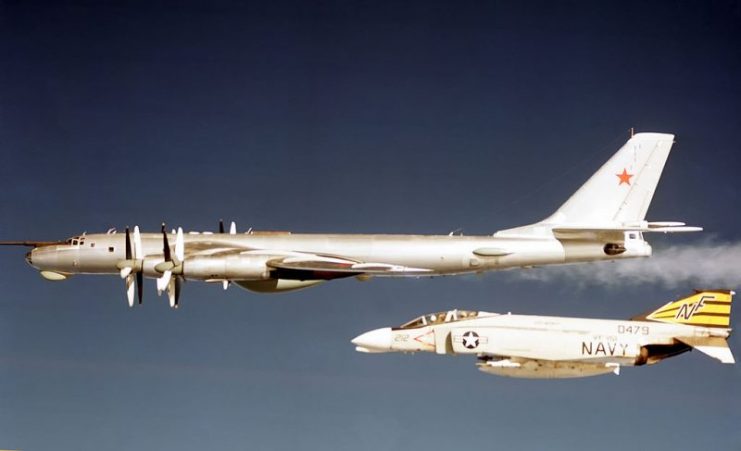 A U.S. Navy McDonnell F-4B Phantom II from Fighter Squadron VF-151 “Vigilantes” intercepting a Soviet Tu-95 Bear D aircraft in the early 1970s