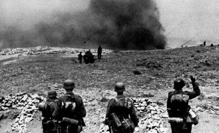 German 11th Army soldiers approach burning Sevastopol in June 1942.