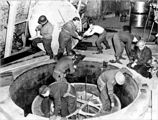 Dismantling the German experimental nuclear pile at Haigerloch, 50 km S.W of Stuttgart, April 1945.