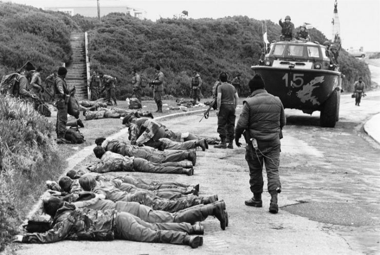 Captured marines laid in the road. Photo by Rafael WOLLMANN/Gamma-Rapho via Getty Images