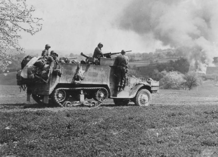 GIs in M3A1 half track attack near Wiezemburg Germany 1945