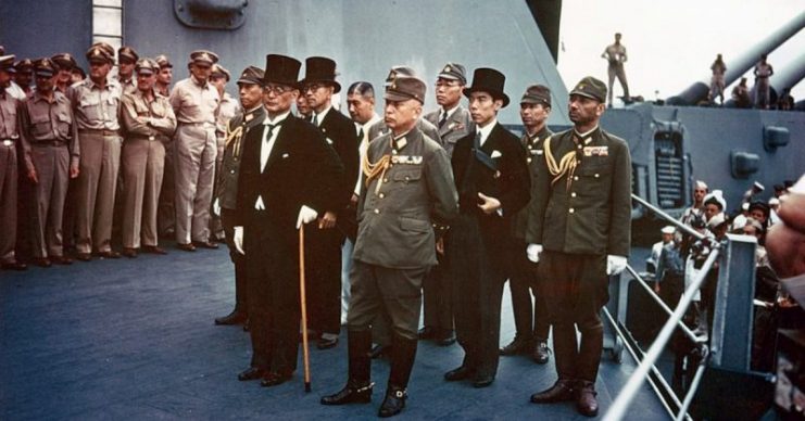 Representatives of the Empire of Japan stand aboard USS Missouri prior to signing of the Instrument of Surrender.