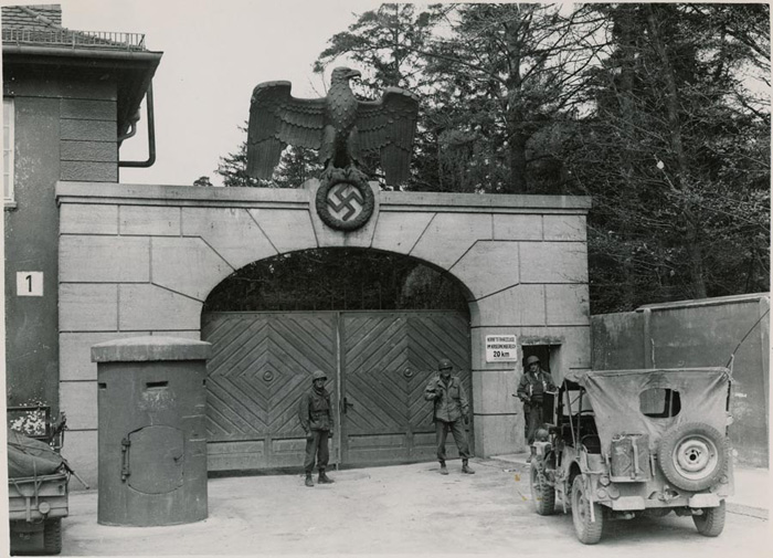 American troops guarding the main entrance to Dachau just after liberation, 1945