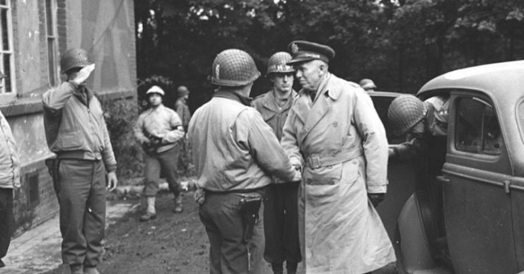 Maj. Gen. Norman D. Cota greets General George C. Marshall, U.S. Chief of Staff, on Gen. Marshall’s arrival at a headquarters in Belgium, 10 22 44. 28th Division, Elsenborn, Belgium.