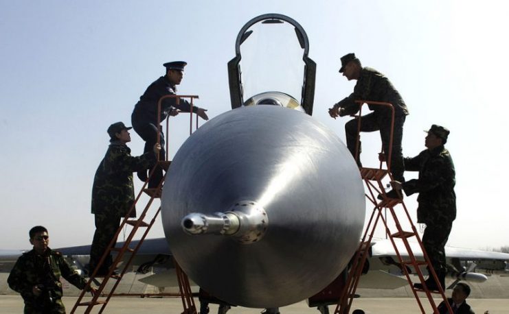 Ground crew observing Chinese Fighter plane A close front view of the Su-27SK fighter aircraft. Image courtesy of Defense Dept. photo by US Air Force Staff Sgt. D. Myles Cullen.