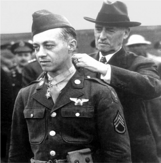 Sergeant Maynard H. Smith, a B-17 Flying Fortress gunner, receiving the first Medal of Honor to be awarded to an enlisted man from US Secretary of War Henry L. Stimson.