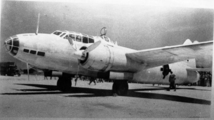 Mitsubishi G4M “Betty” bomber on Ie Shima, August 19, 1945, having carried a Japanese surrender delegation to the island. Note white paint with green cross insignia.