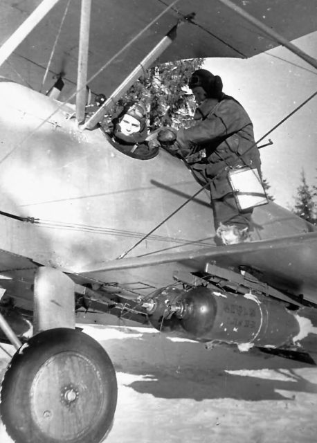 A Po-2 loaded with bombs getting reading to go on a mission.
