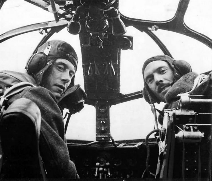RAF pilots seated at controls of Short Stirling 41