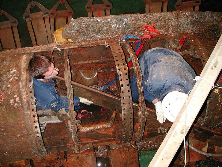 Removing the first section of the crew’s bench at the Warren Lasch Conservation Center, January 28, 2005