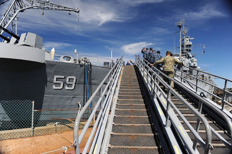 Chief petty officer (CPO) selectees, assigned to U.S. Naval War College, Naval Station Newport, and Naval Undersea Warfare Center in Newport, R.I., arrive onboard the South Dakota class battleship, USS Massachusetts (BB-59), in Fall River, Mass., to participate in a community relations (COMREL) project.