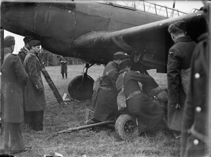 Royal Air Force- France 1939-1940. King George VI watching bombs being hand-winched into the bomb-bays of a Fairey Battle, during his tour of the Western Front.