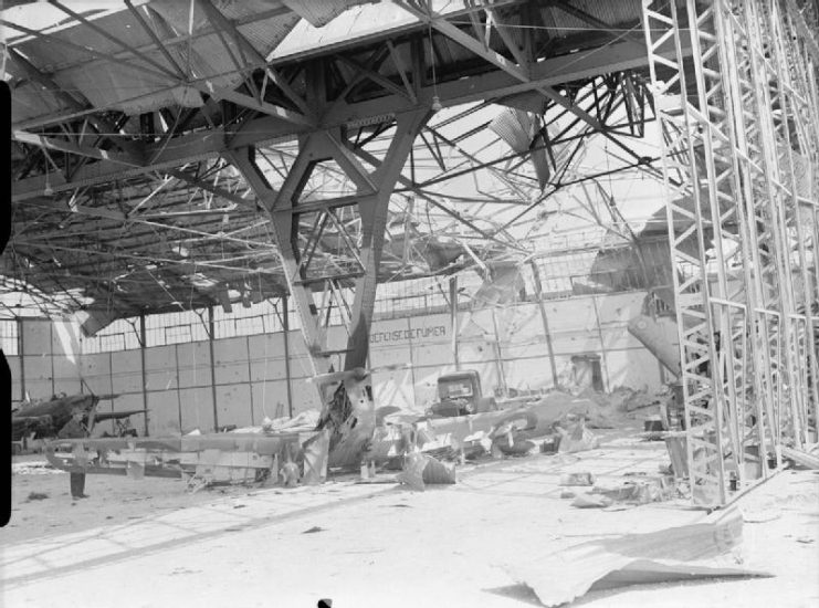 Royal Air Force- France, 1939-1940. Interior of a bombed hangar at Mourmelon-le-Grand after a heavy German attack on the airfield on 14 May 1940. The remains of a Miles Magister and at least two Fairey Battles, belonging to No. 88 Squadron RAF, can be seen in the wreckage.