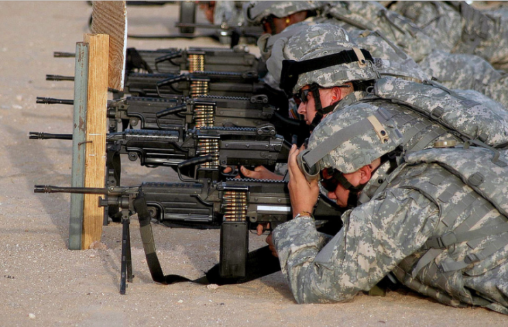U.S. Army Guardsmen, from the the Texas Army National Guard (TXARNG) Headquarters and Services Company, 449th Aviation Support Battalion, test fire their M249 Squad Automatic Weapon during Operation Iraqi Freedom at Logistic Support Area (LSA) Anaconda, Balad Air Base, Iraq, on Oct. 2, 2006. (A3606)