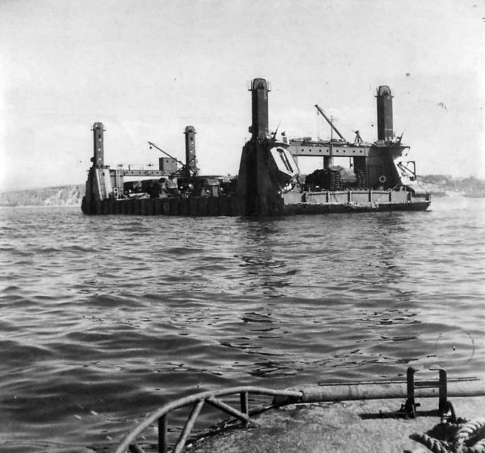 Spud Pier Section of Mulberry B Harbor Arrives at Arromanches Normandy