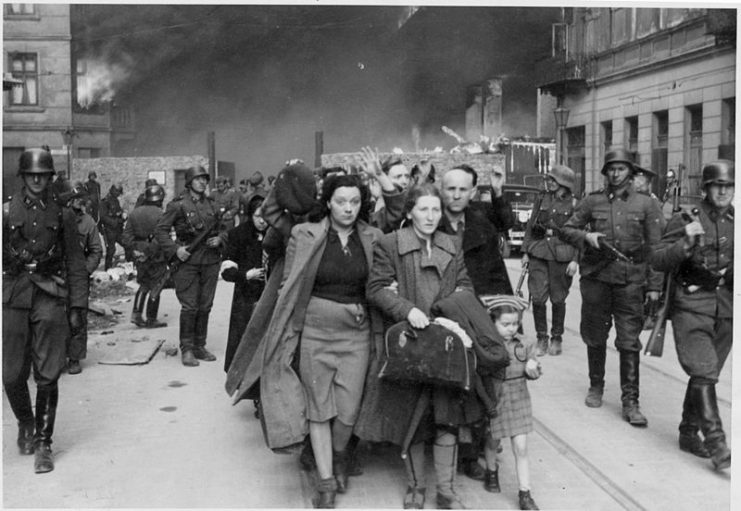 Jewish POWs being forced out after the Getto uprising onto waiting trains.