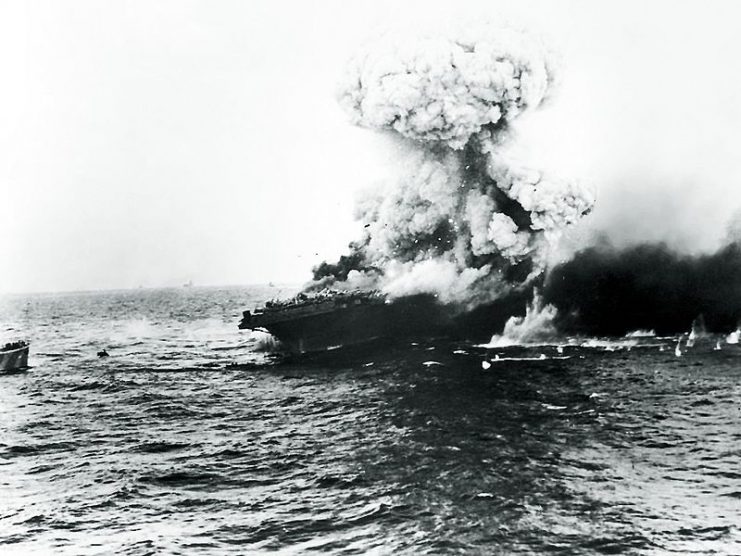 The American aircraft carrier USS Lexington explodes on 8 May 1942, several hours after being damaged by a Japanese carrier air attack.