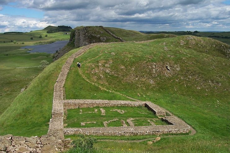 The remains of Milecastle 39 (coordinates on Hadrian’s Wall; near Steel Rigg, looking east from a ridge along the Hadrian’s Wall Path. By Mike Quinn CC BY SA 2.0