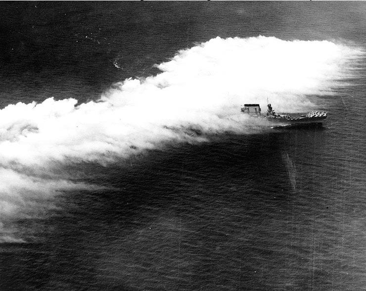 The U.S. Navy aircraft carrier USS Lexington (CV-2) steams through an aircraft-deployed smoke screen off Panama, 26 February 1929, shortly after that year’s “Fleet Problem” exercises.