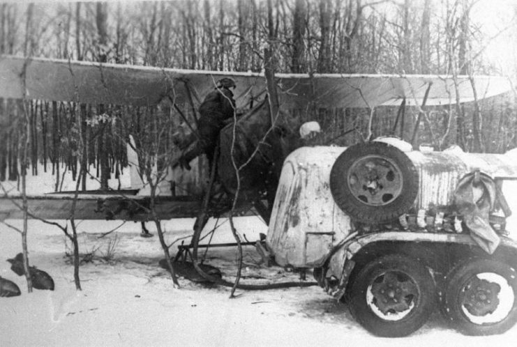 A female pilot prepares for a mission in her Po-2