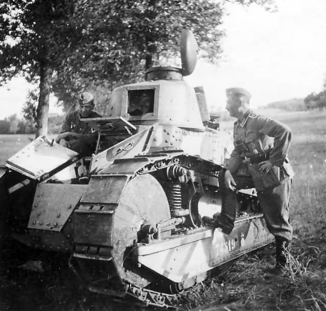 Two German soldiers posing with a tank FT-17 1940