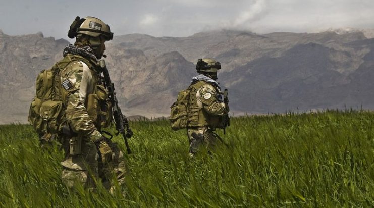 U.S. Army Special Forces soldiers from the 3rd Special Forces Group patrol a field in the Gulistan district of Farah, Afghanistan