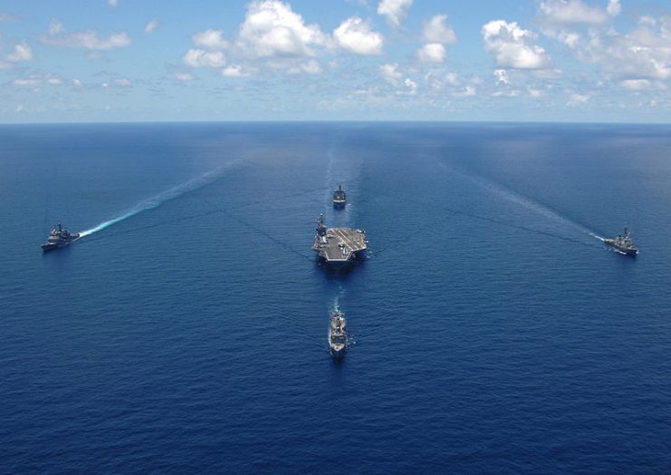 U.S. Navy ships assigned to the George Washington Carrier Strike Group sail in formation for a strike group photo in the Caribbean Sea.2006