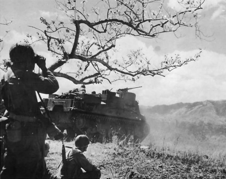 US 25th Division troops and M7 Priest named “Hairless Joe” advancing through the Caraballo mountains on Luzon 1945