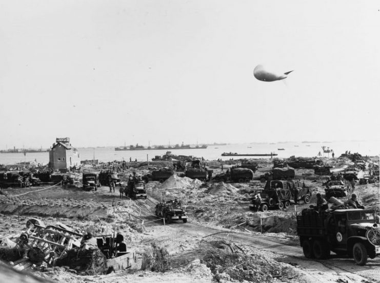 US Army trucks move inland from Omaha Beach